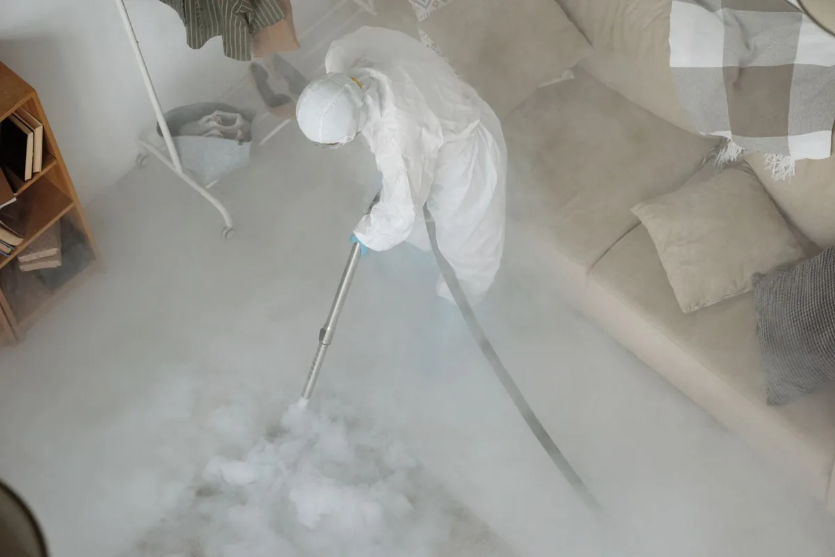 Biohazard cleanup technician in protective equipment, Hartford, CT